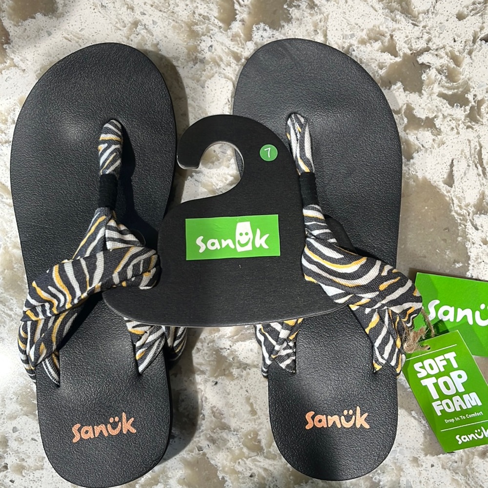 Brand new Sanuk sandals.